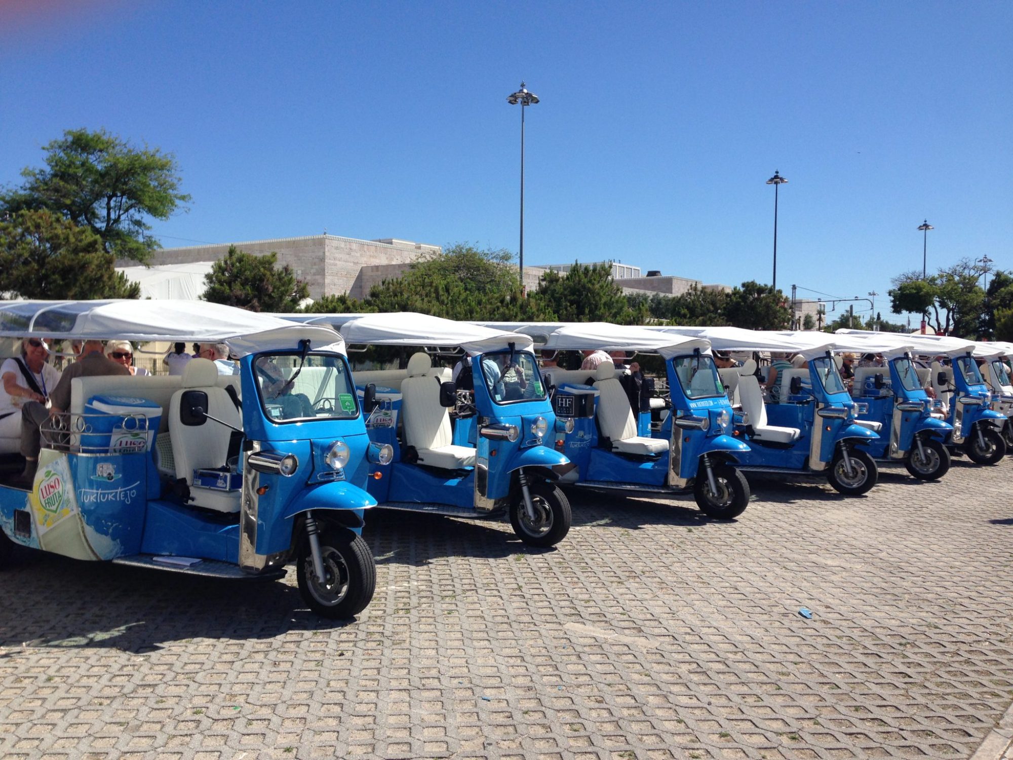 a blue truck parked in a parking lot