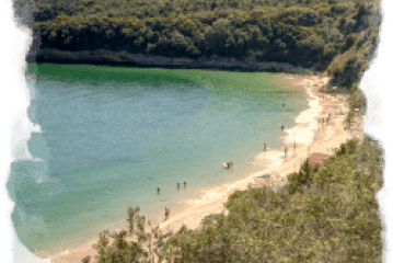 a body of water with a mountain in the background