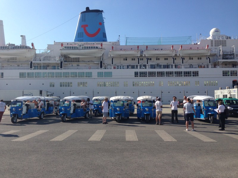 a group of people standing in a parking lot