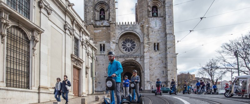 a group of people walking in front of a building