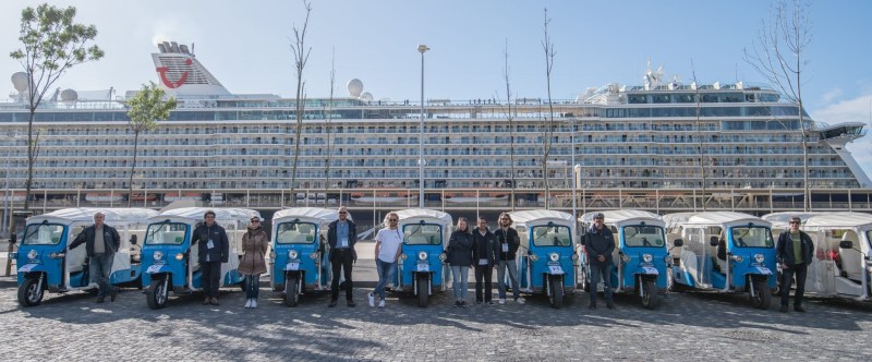 a group of people standing in front of a crowd